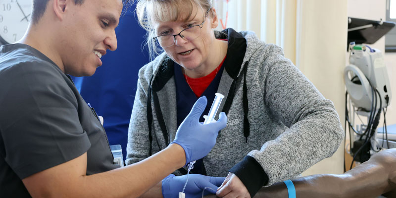 CNCC nursing student with an instructor.